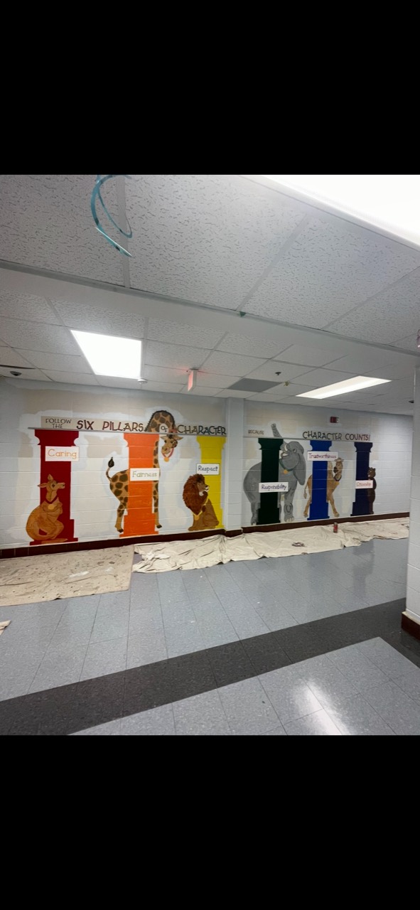 School corridor murals protected during repainting