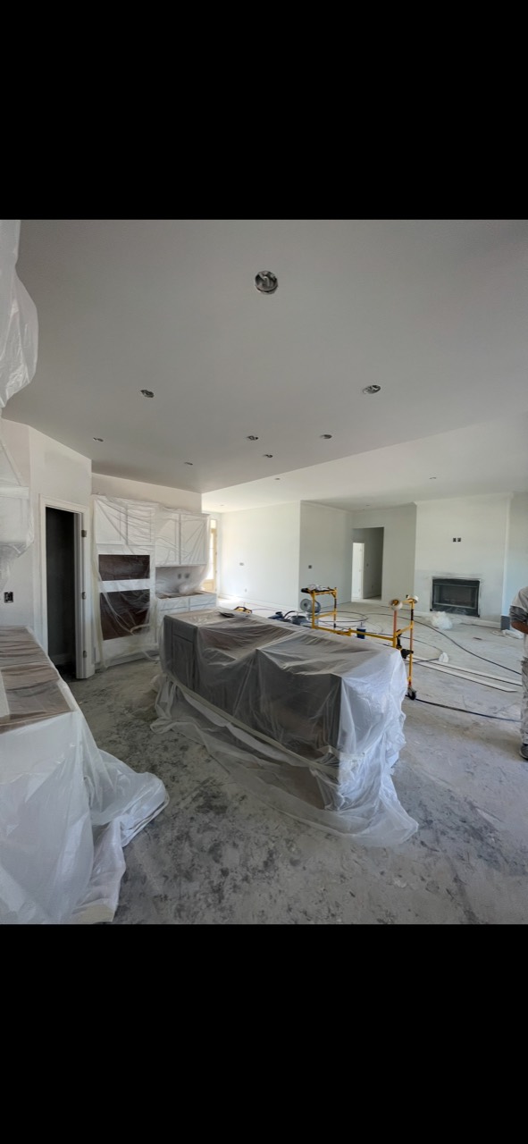Protected kitchen and open living area during new-construction painting
